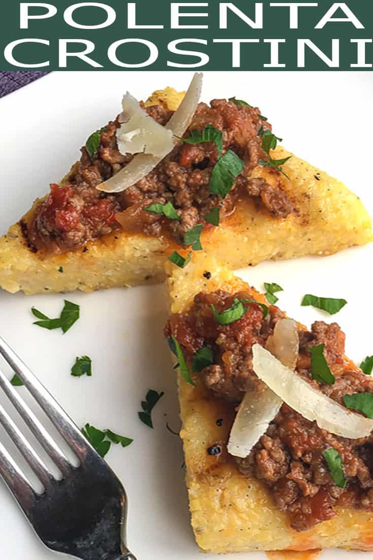 You will love this Grilled Polenta Crostini recipe! Grilled polenta wedges are topped with a hearty meat sauce, shaved Pecorino Romano, and parsley for a mouthwatering appetizer. #polenta #grilledpolenta #crostini #polentarecipes #appetizer #appetizerrecipe