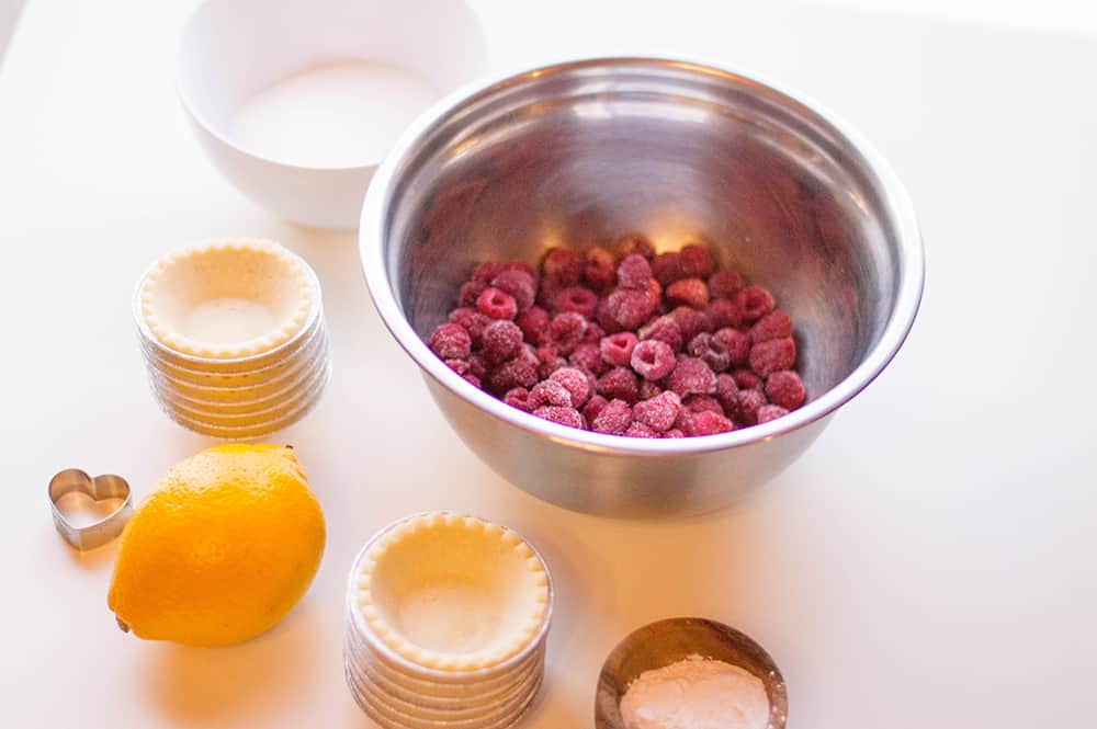 Frozen raspberries and lemon with mini pie crusts