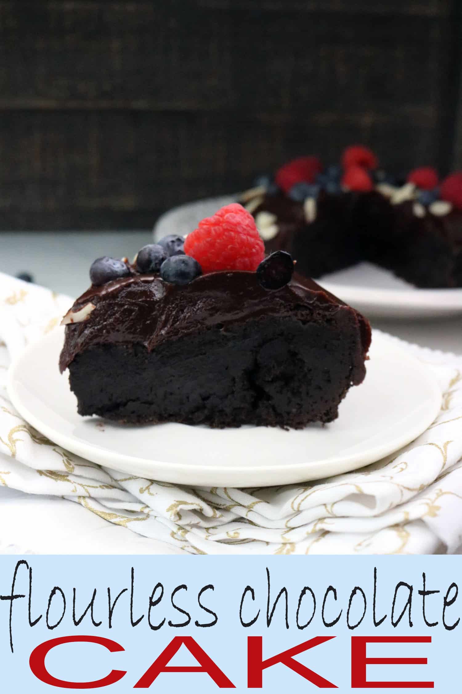 Ready for the BEST gluten free cake EVER? This flourless chocolate cake topped with a rich dark chocolate ganache will have you reaching for seconds and thirds (but we won't tell anyone)!! #glutenfreecake #glutenfreechocolatecake #flourlesscake #chocolatecake