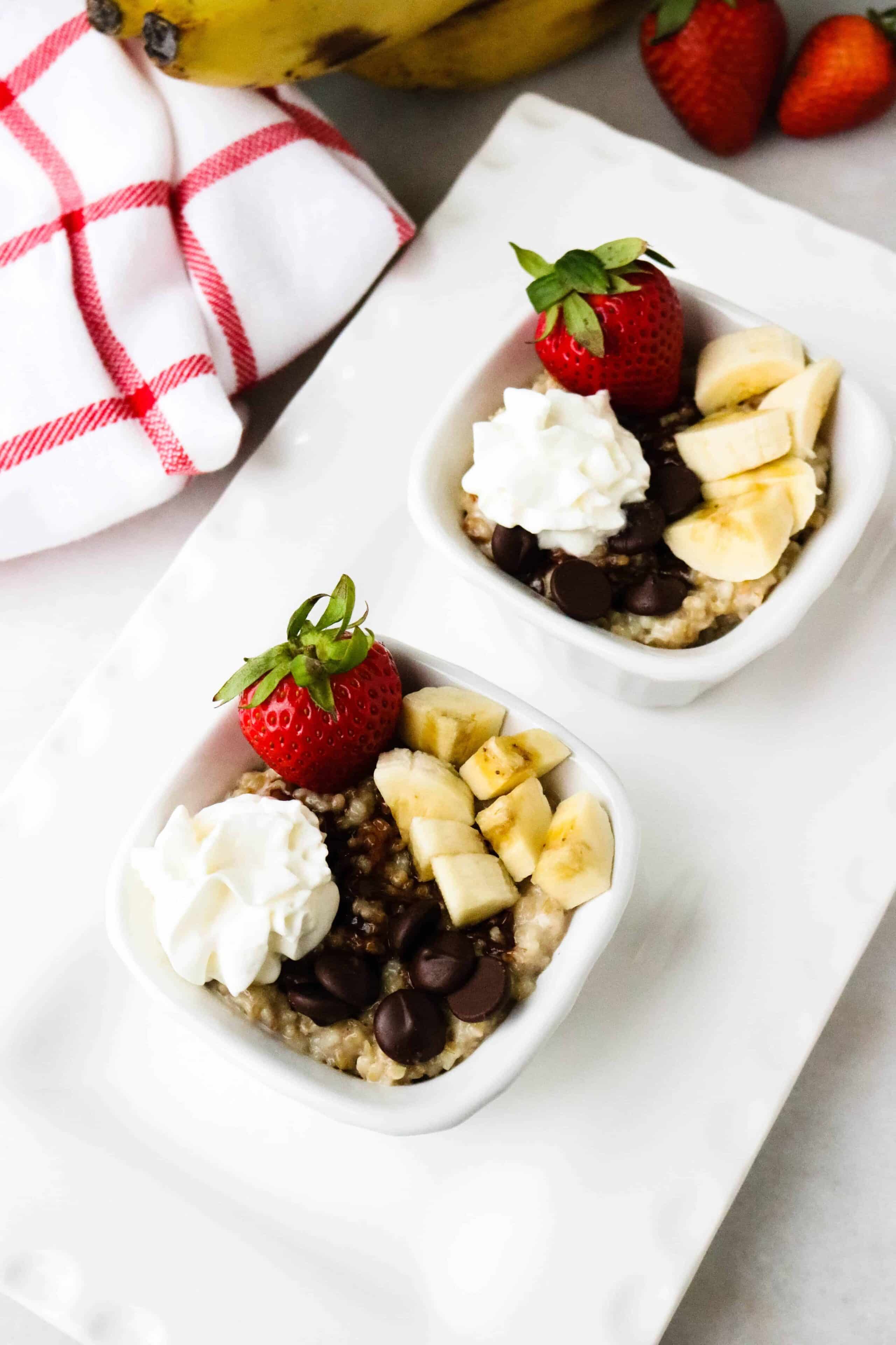 Two servings of Instant Pot steel cut oats - Banana Split Oatmeal in white bowls on a large white plate