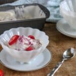 Permalink to: Berry Pie No-Churn Ice Cream A serving of Berry Pie No-Churn Ice Cream in a white scalloped edged bowl next to a silver spoon