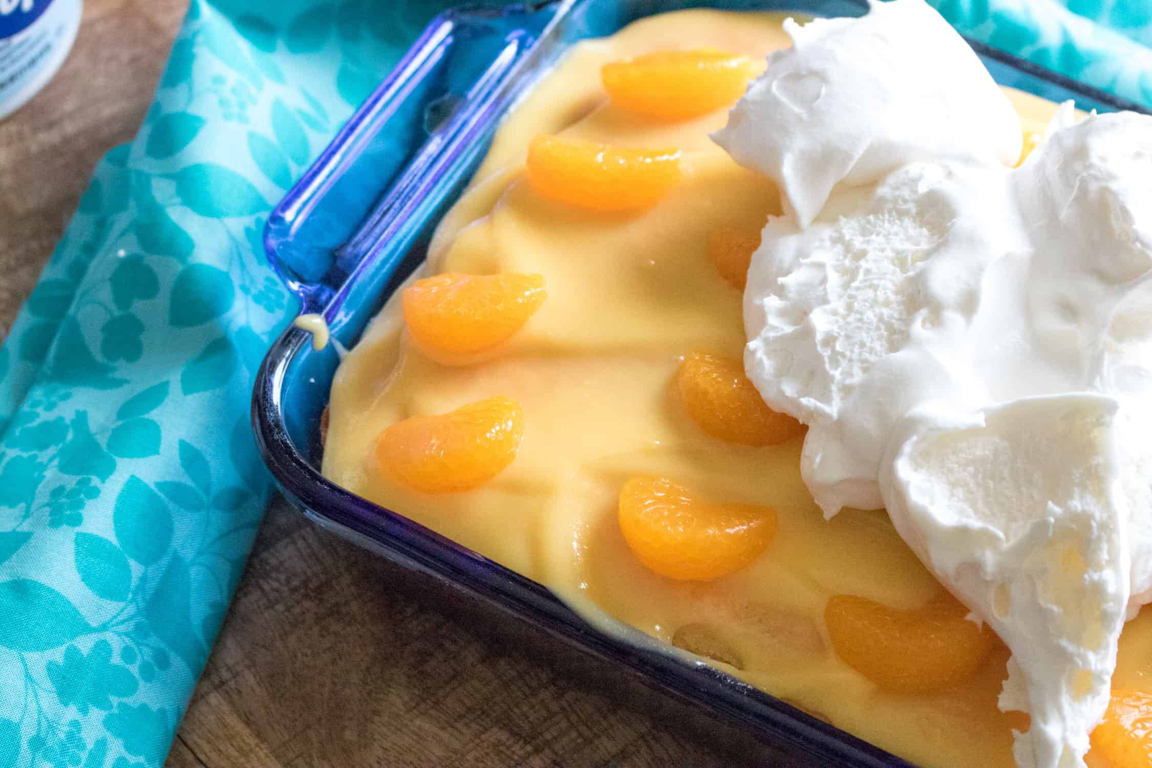 Cake with gelatin, vanilla pudding, mandarin oranges and whipped topping