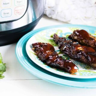 Instant Pot Rib Tips served on a blue print plate