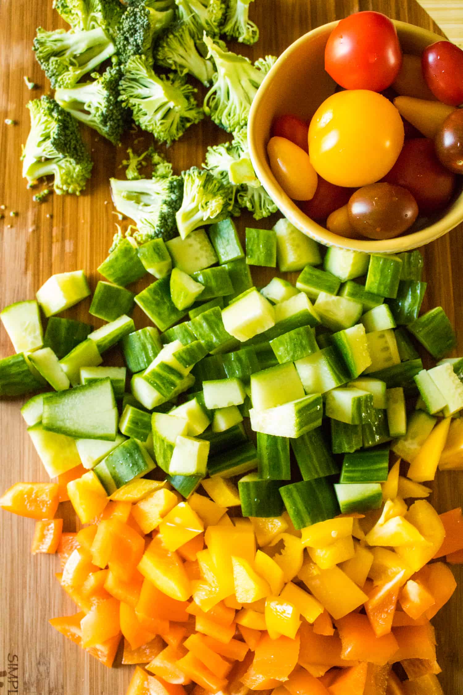 Broccoli, cucumber and bell pepper chopped, tomatoes left whole