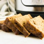 Permalink to: Instant Pot Banana Cake — Easy Instant Pot Cake Recipe Slices of Instant Pot Banana Cake on a wood cutting board in front of the Instant Pot