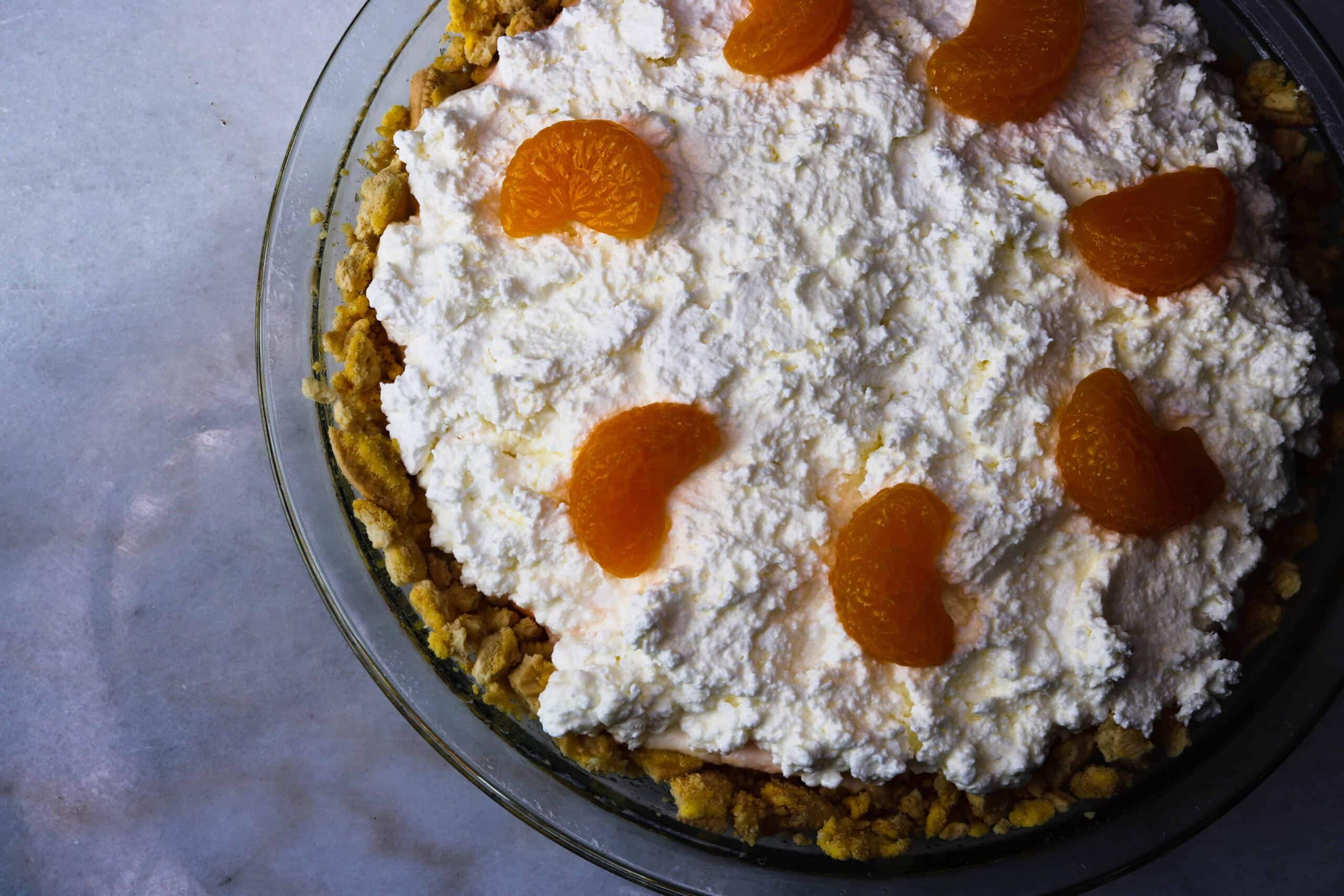 Crust, first layer, second layer and Mandarin oranges in pie pan