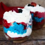 Permalink to: 4th of July Mini Cake Trifle — Fun and Festive 4th of July Desserts Two 4th of July Mini Cake Trifles served in glass dessert cups and garnished with araspberry and blueberry