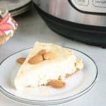 Permalink to: Instant Pot Grain-Free Keto Cheesecake slice of Instant Pot Keto GF Cheesecake served on a white dessert plate