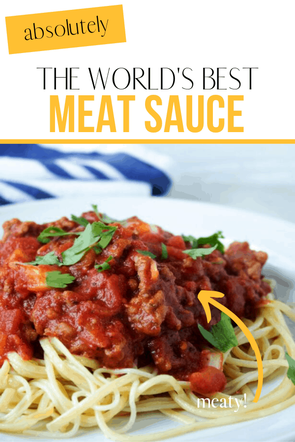 meat sauce on top of a plate of noodles