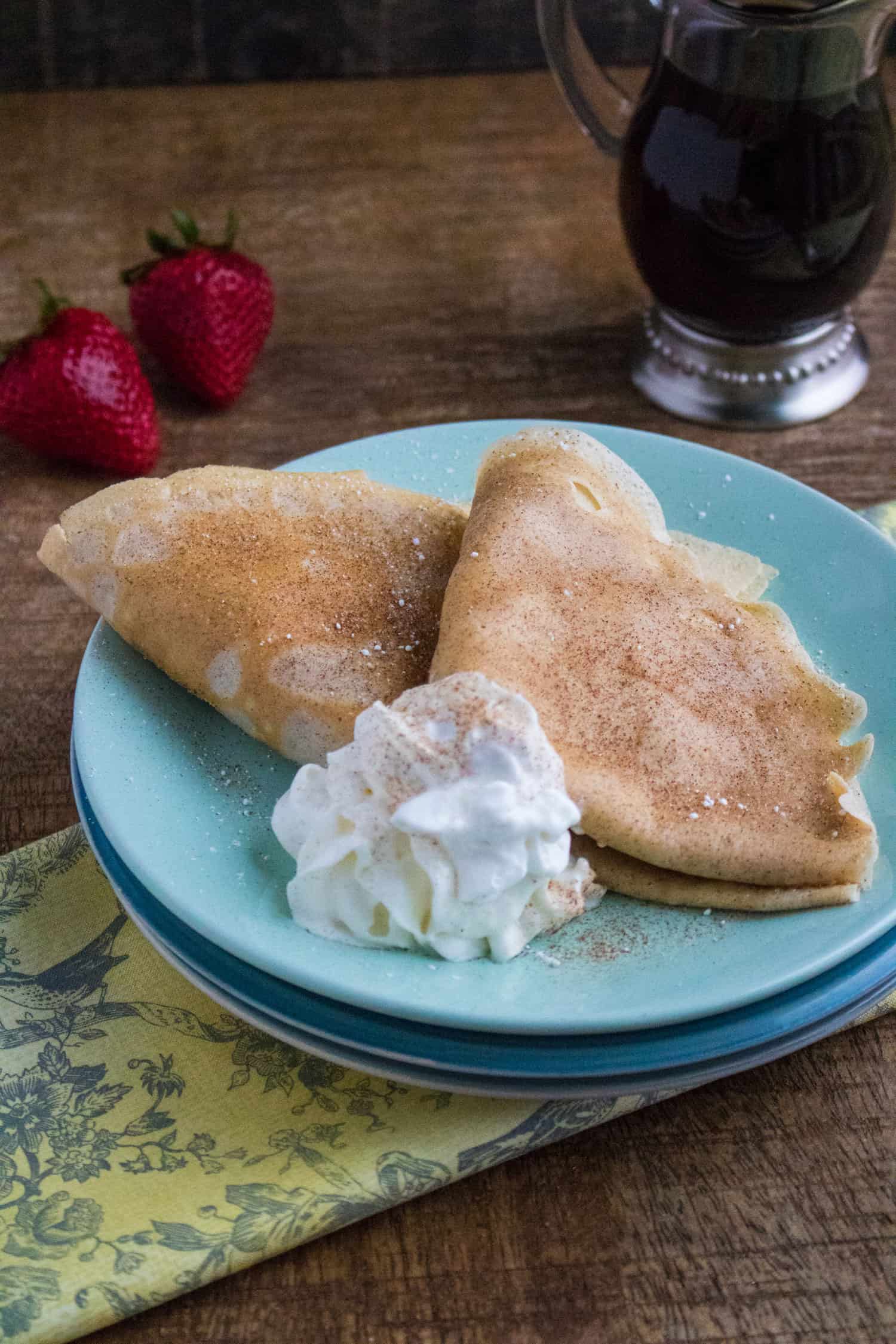 crepes on blue plates with whipped cream