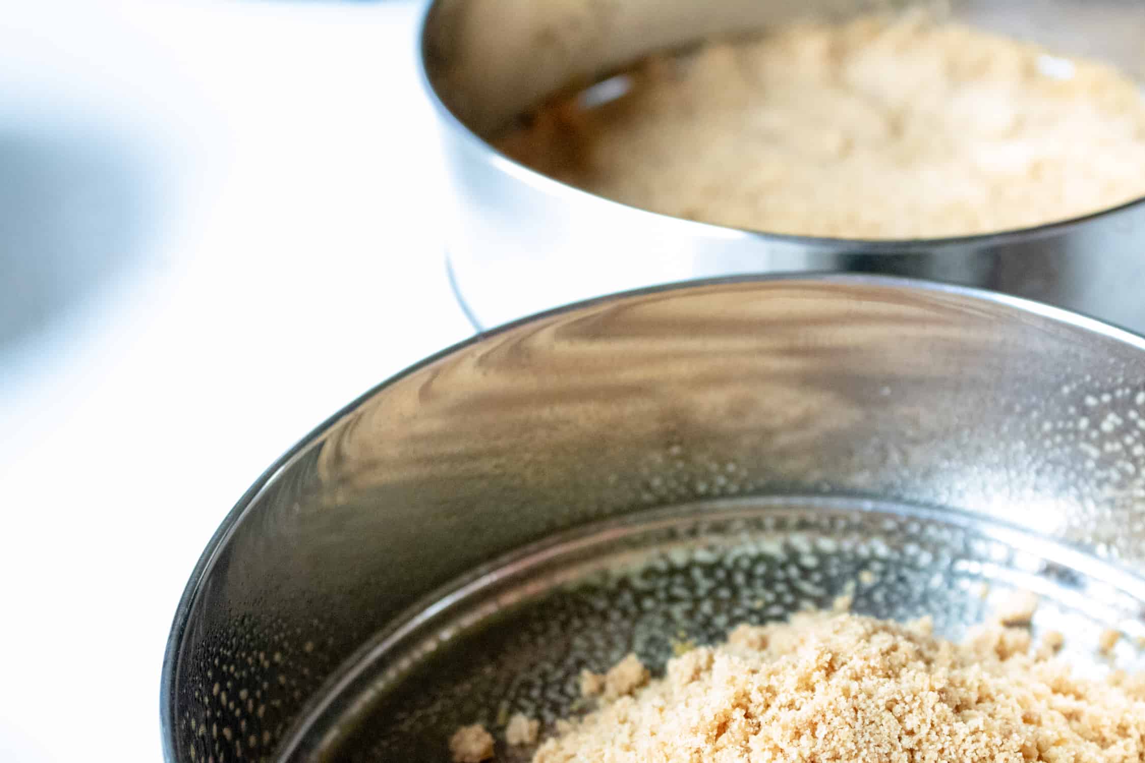 close-up photo of the graham cracker crumb crust inside the springform pan