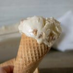 One scoop of Peanut Butter No-Churn Ice Cream served on a sugar cone