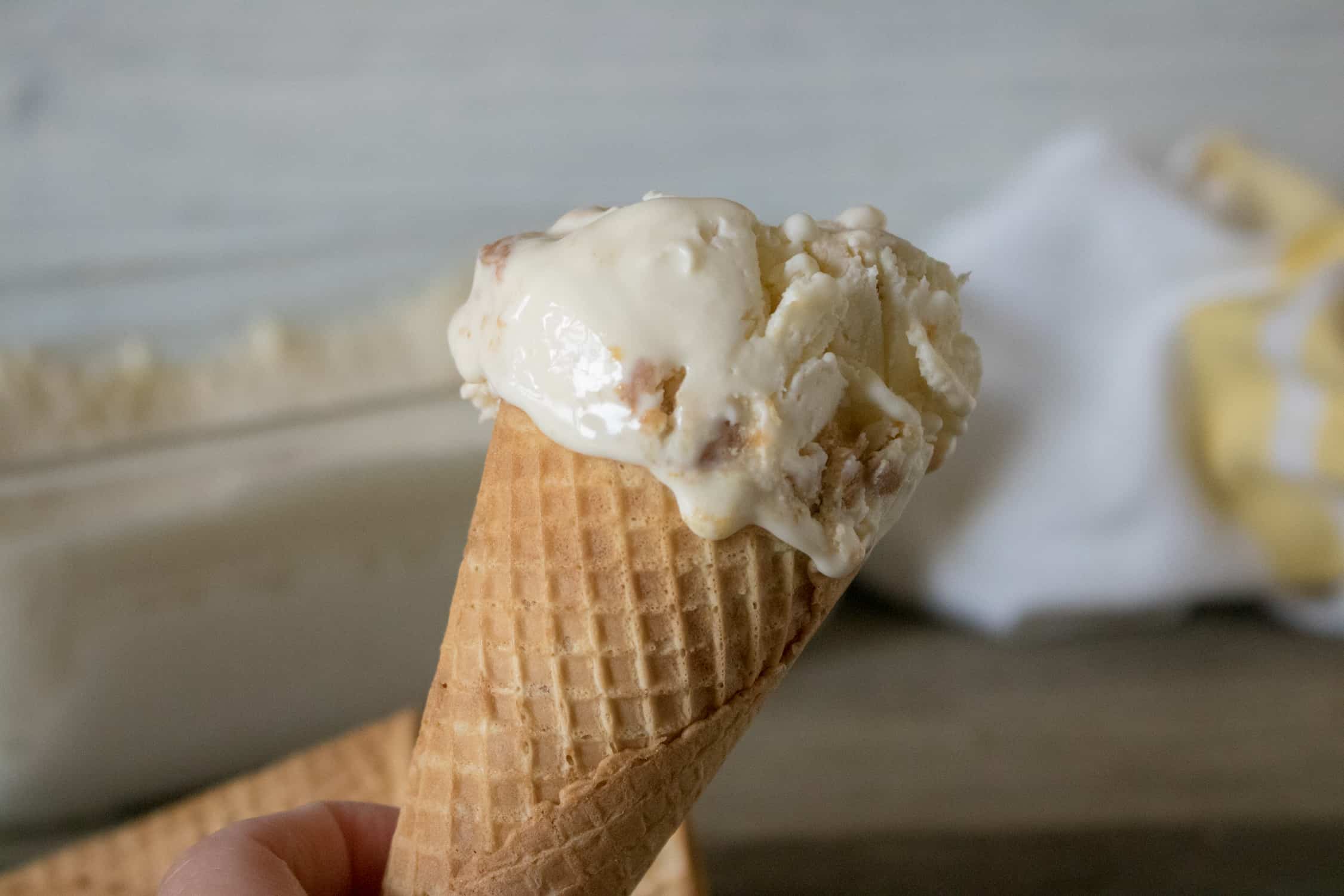 One scoop of Peanut Butter No-Churn Ice Cream served on a sugar cone