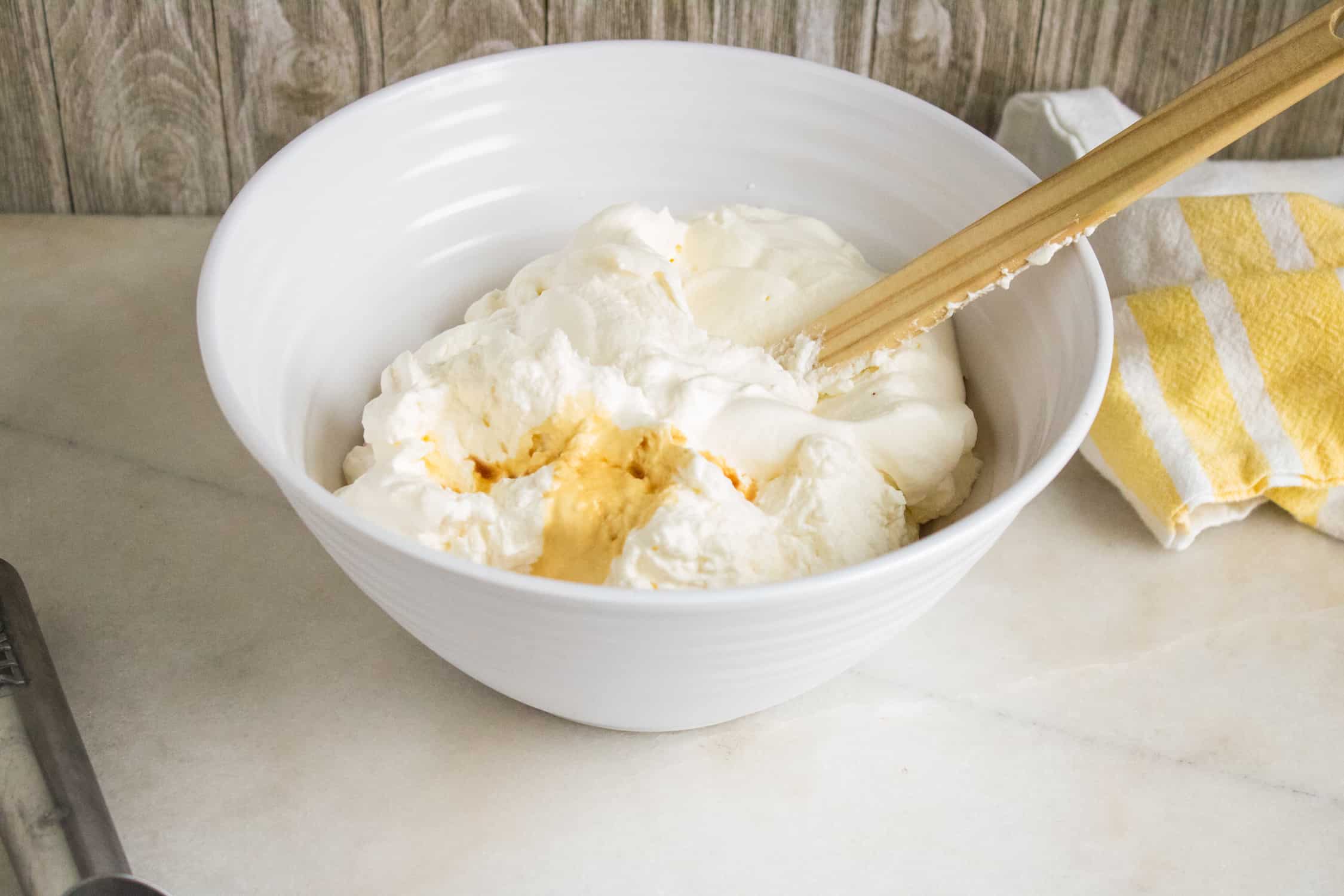 thick, heavy whipping cream in a white bowl