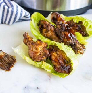 Instant Pot Chicken Wings and Sticky Sauce served on lettuce leaves