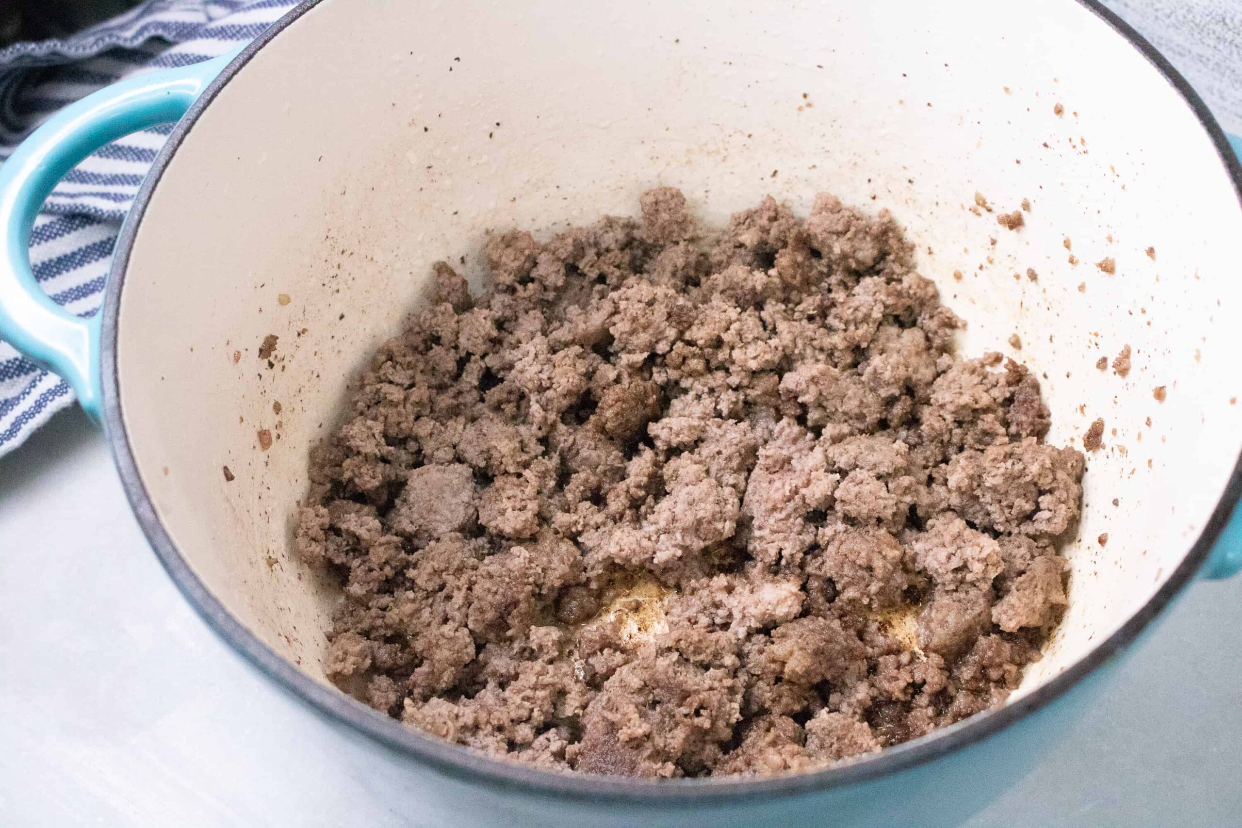 cooked ground beef in a stockpot to make Poor Man's Soup