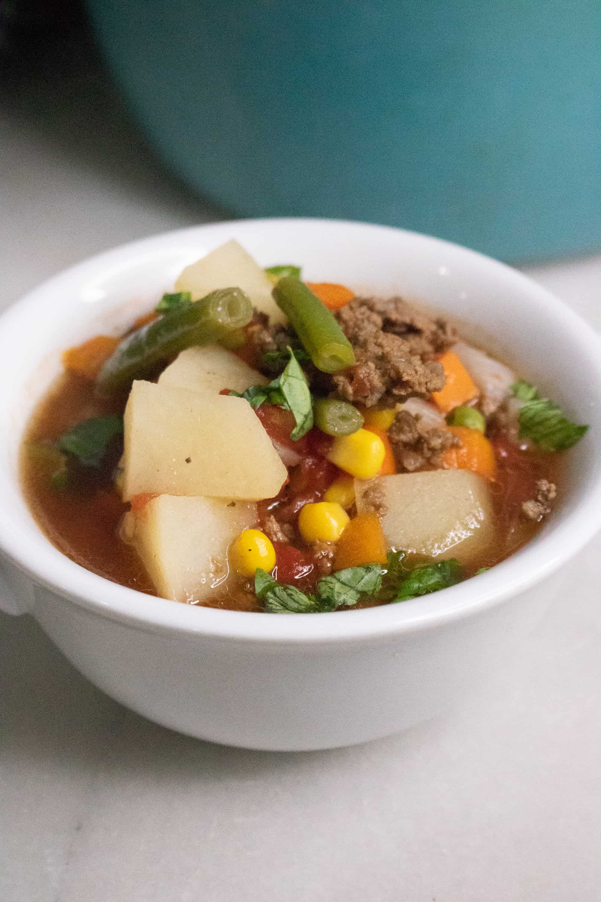 white bowl with meat and vegetable Poor Man's Soup