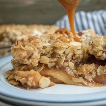 caramel being drizzled over the apple crumble pie