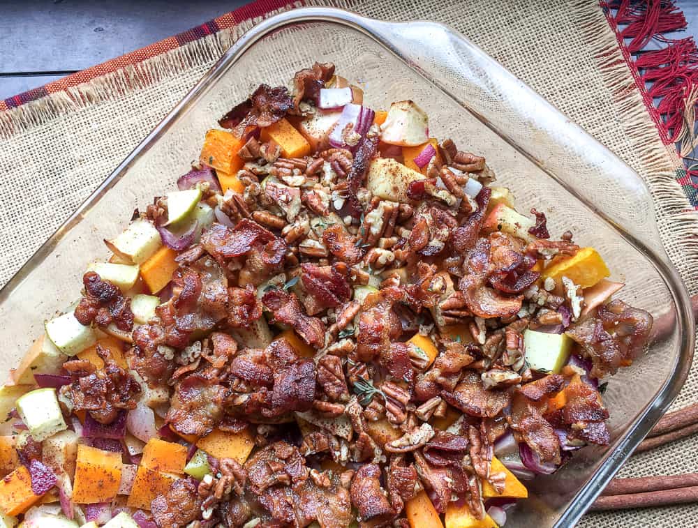 Apple Butternut Squash Casserole with Bacon Pecan Topping in a glass casserole dish