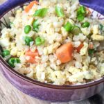 The finished Cauliflower Fried Rice served in a ceramic bowl