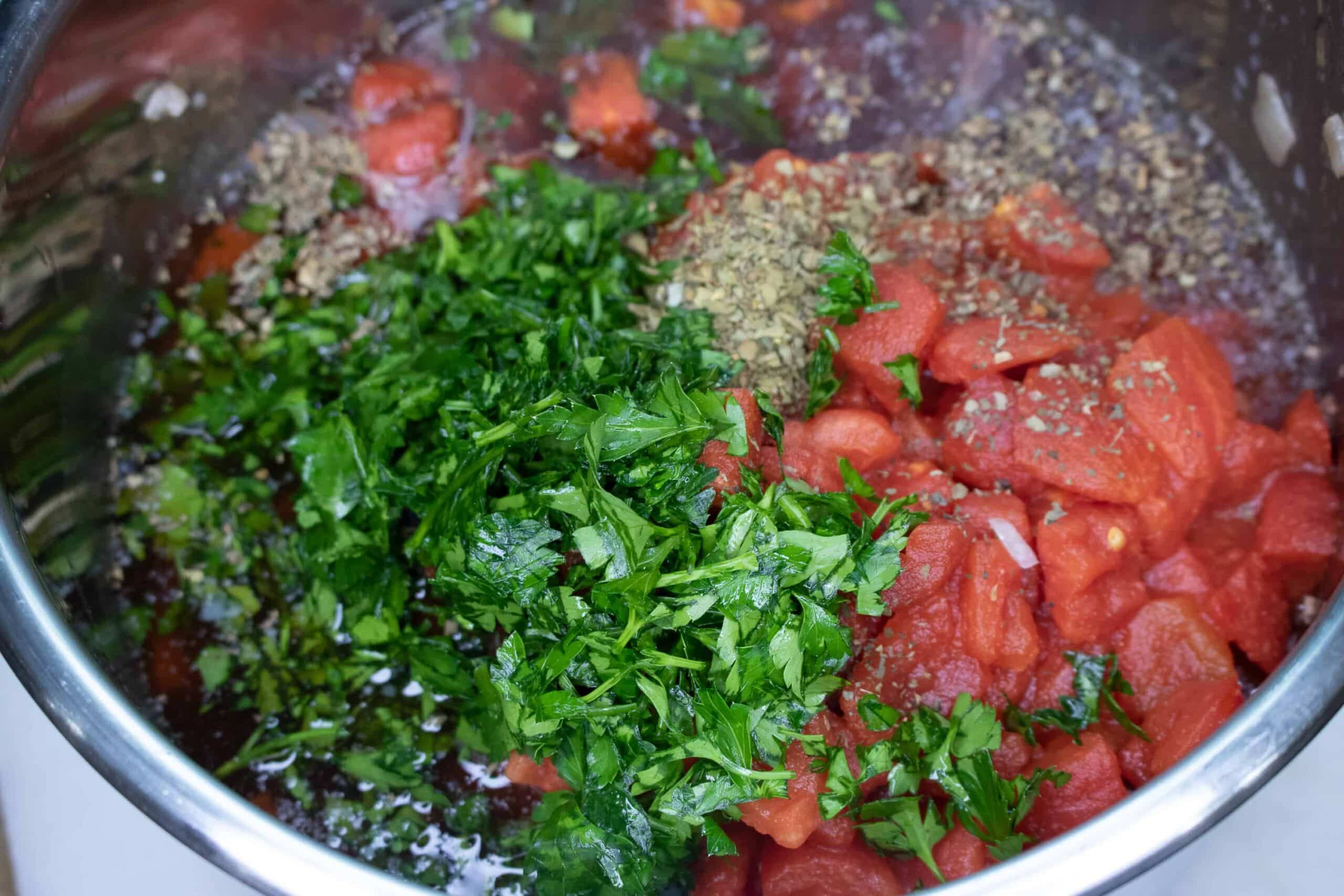 adding fresh herbs to Poor Man's Beefy Tomato Macaroni Instant Pot Soup