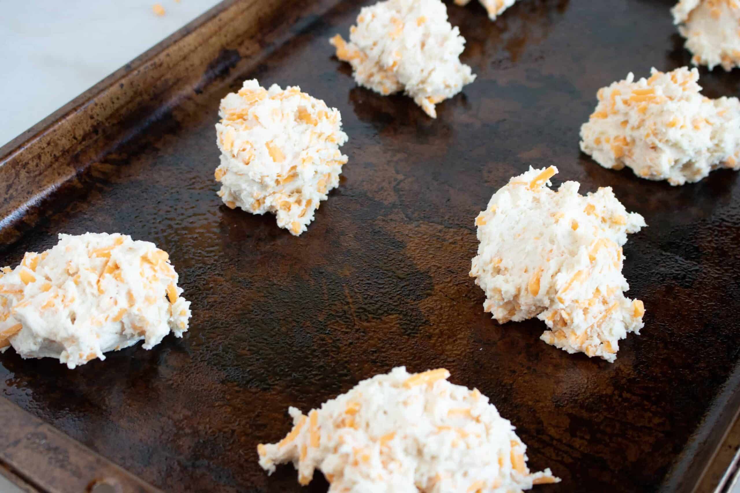 uncooked Red Lobster Copycat Cheddar Biscuits on a baking sheet and ready for the oven