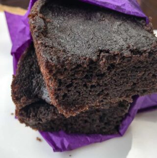 close up view of two Chocolate Cherry Brownies wrapped in a purple napkin