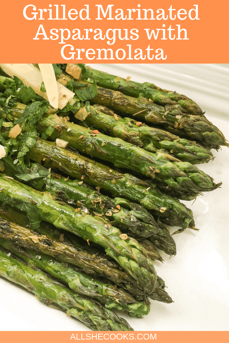 close up of grilled marinated asparagus with gremolata