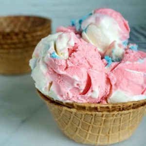 red, white and blue ice cream scoops in ice cream cone bowls.