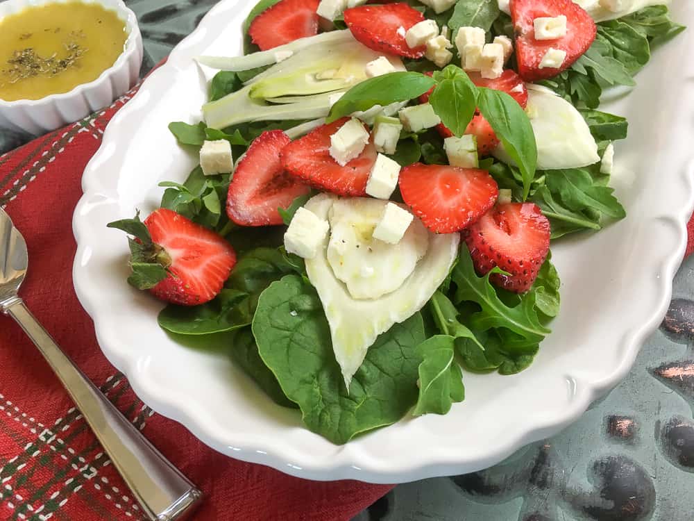 strawberry fennel salad served on a white platter