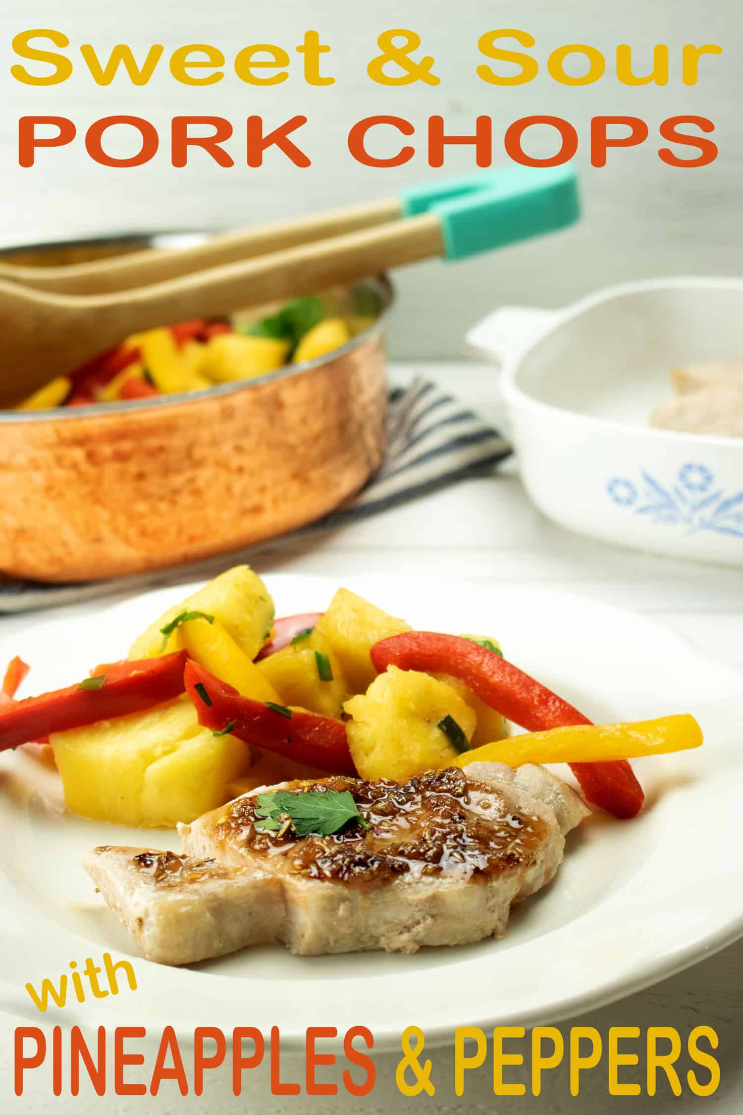 healthy baked pork chop recipe on white plate with vegetables