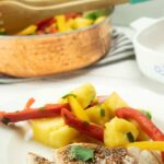 Permalink to: Healthy Easy Sweet and Sour Pork Chops Recipe with Pineapple and Peppers plated healthy pork chop recipe on white plate with pineapples and yellow and red bell peppers