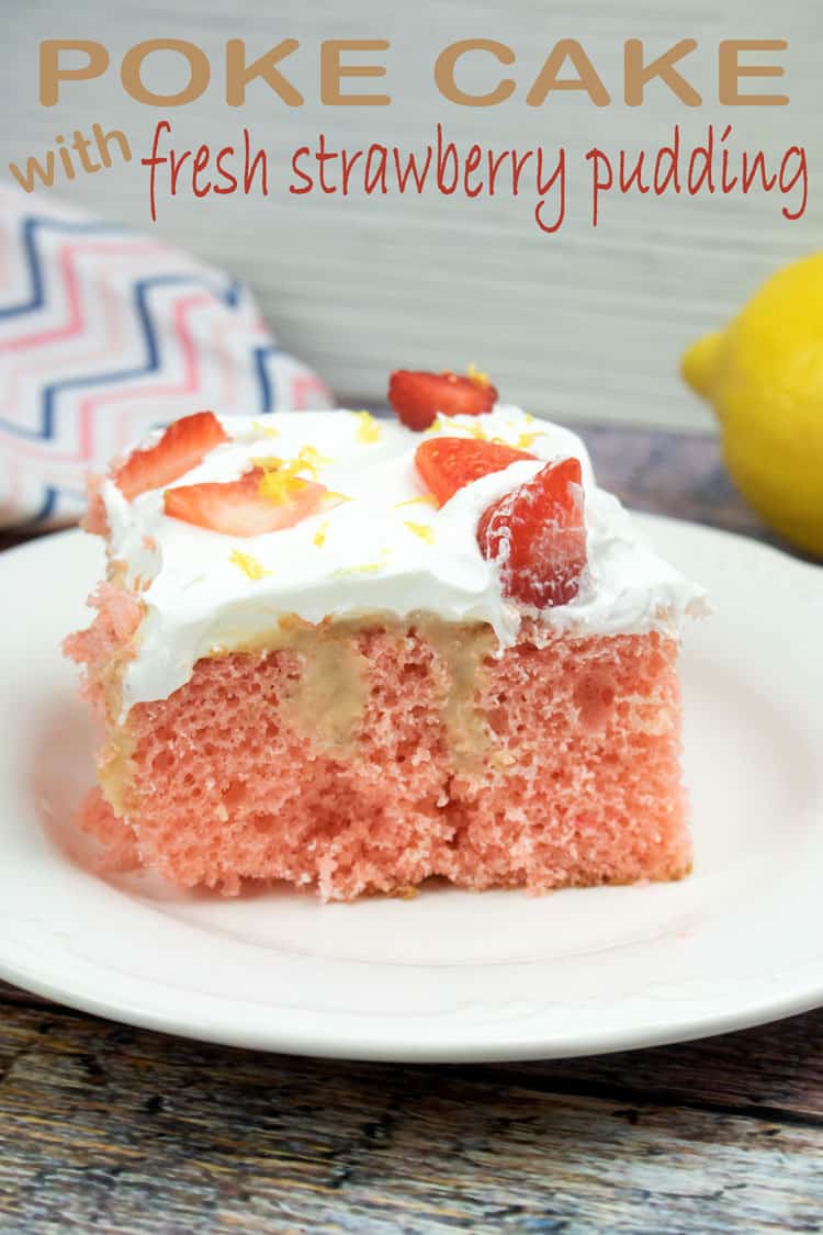 strawberry poke cake with slices strawberries on top, on a white plate with a lemon and colorfully striped napkin in the background