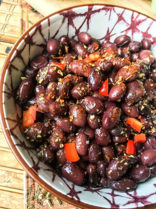 black beans with spices in a bowl on table