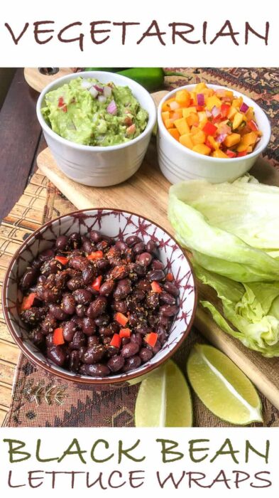 spicy black bean taco wripas on a cutting board with lettuce wraps by it