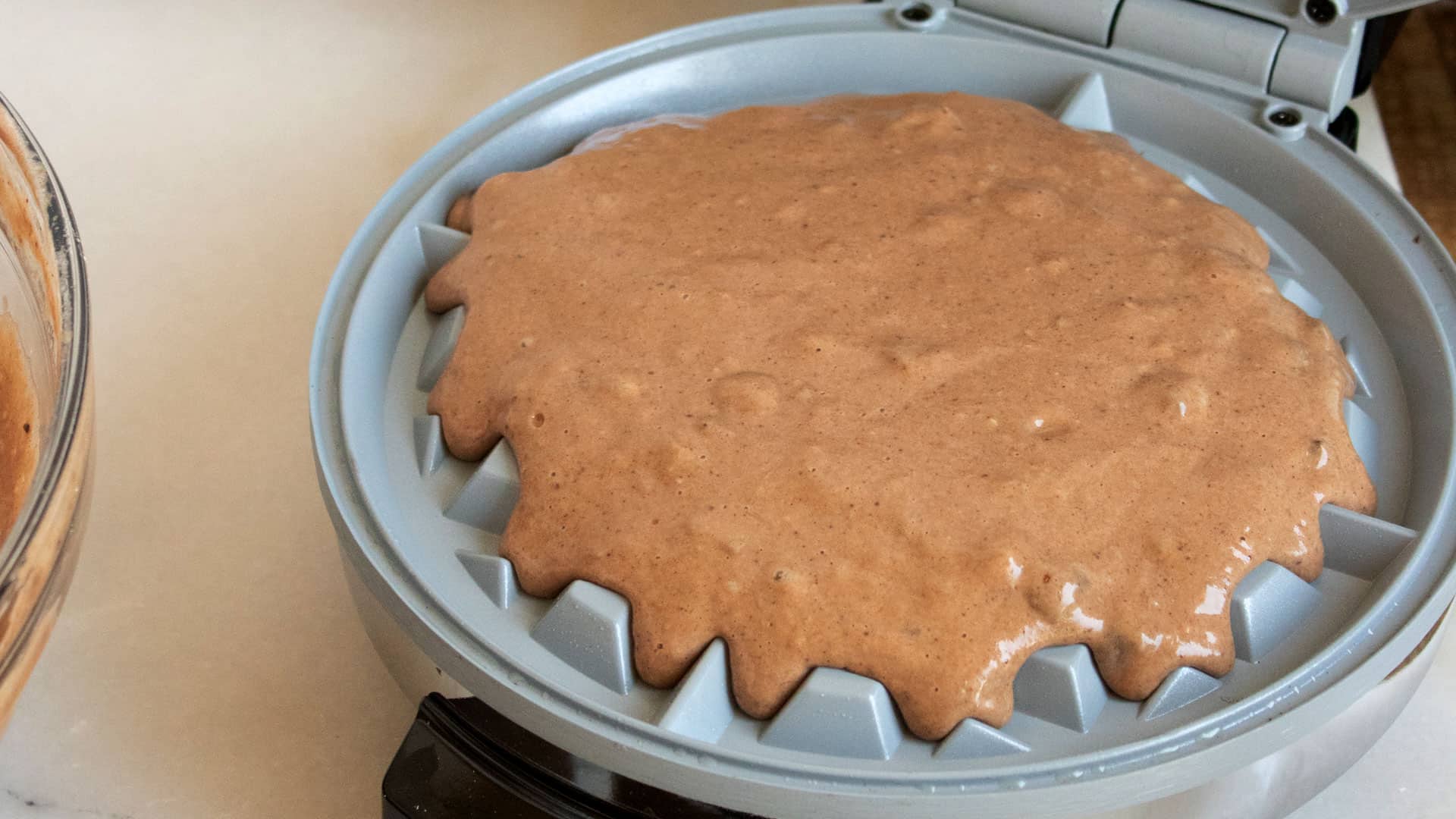 waffle batter in Belgian waffle maker