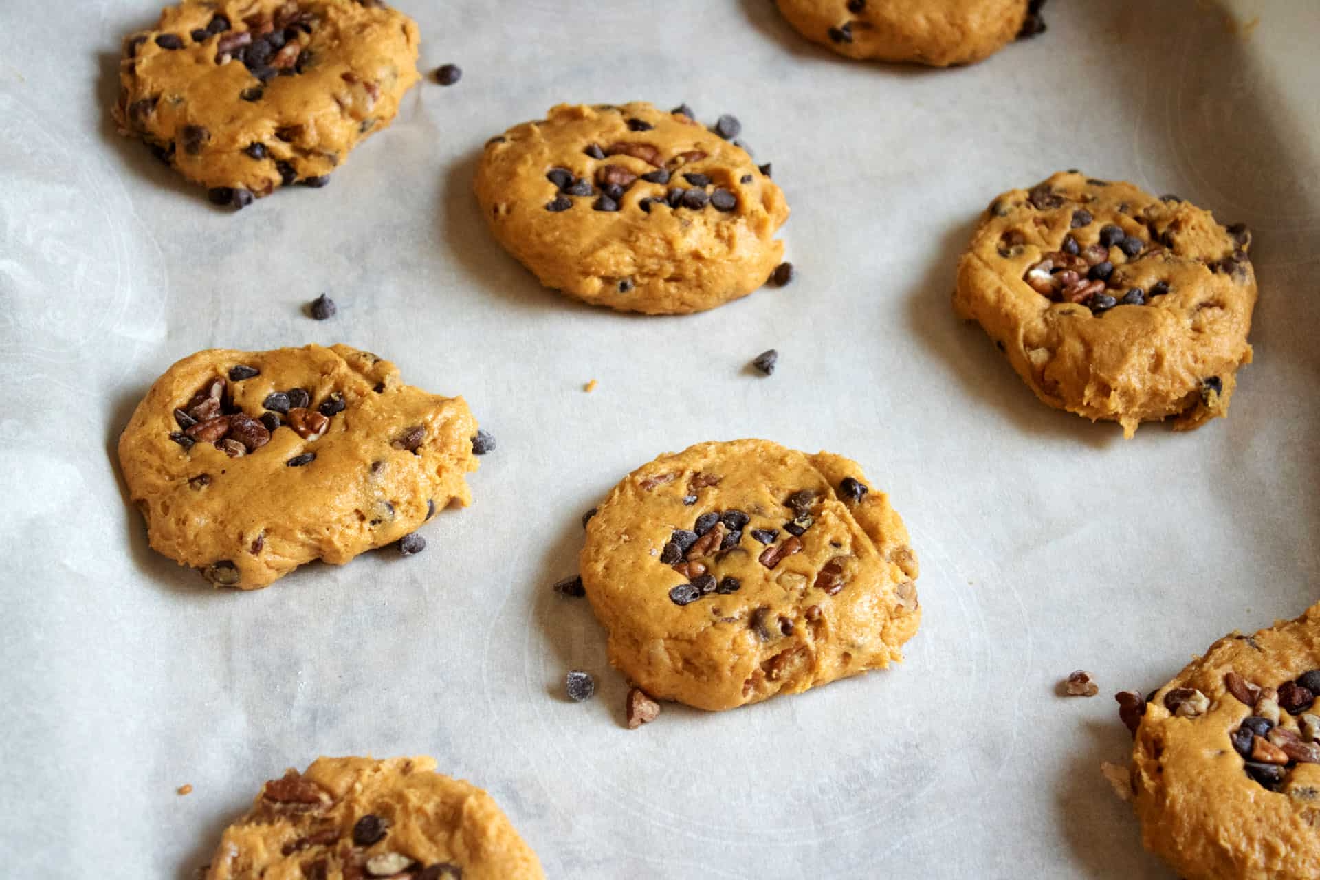 pumpkin chocolate chip cookie dough on a baking sheet