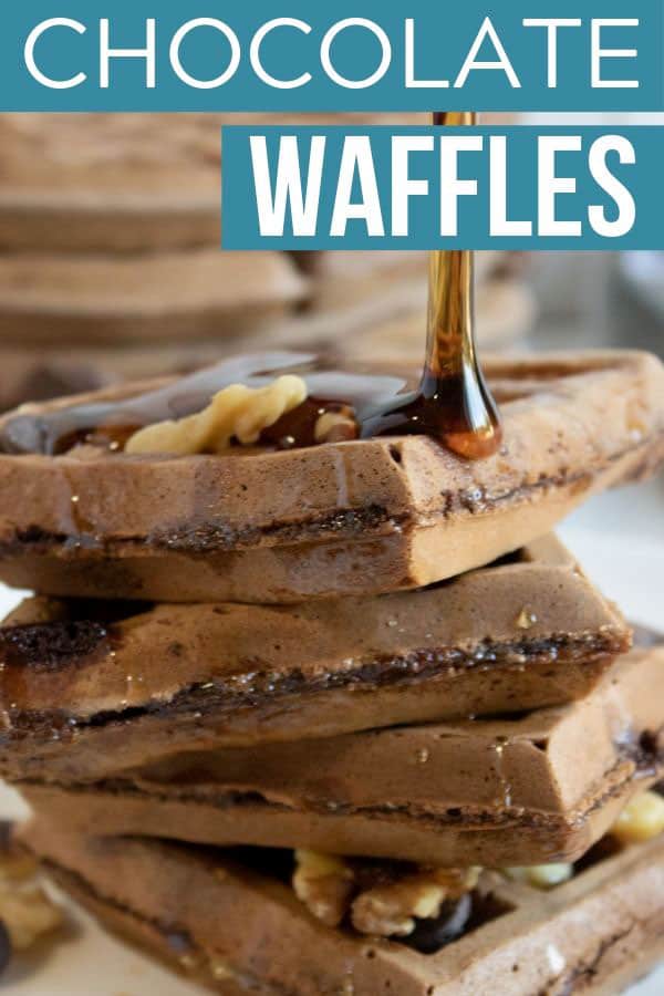chocolate waffles with syrup being poured on them