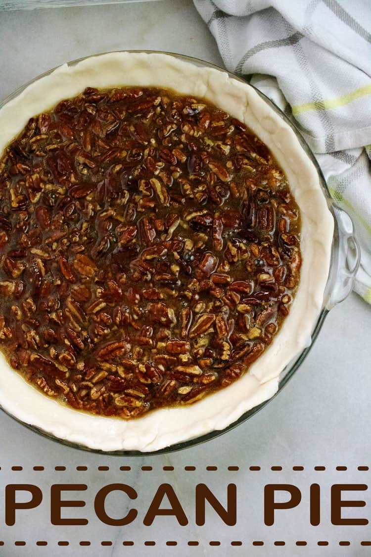 pecan pie filling in pie shell on table 