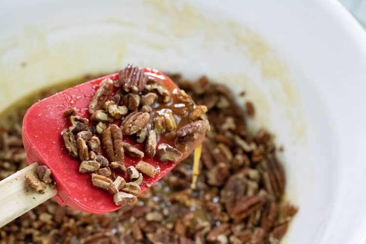 nuts on a spatula for meringue pecan pie