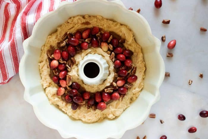 cranberries and pecans in bundt pan