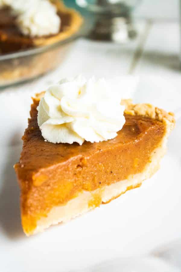sweet potato pie topped with whipped cream