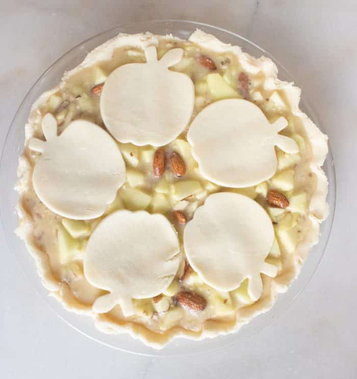 almond apple pie with apple shaped crust cut-outs on top