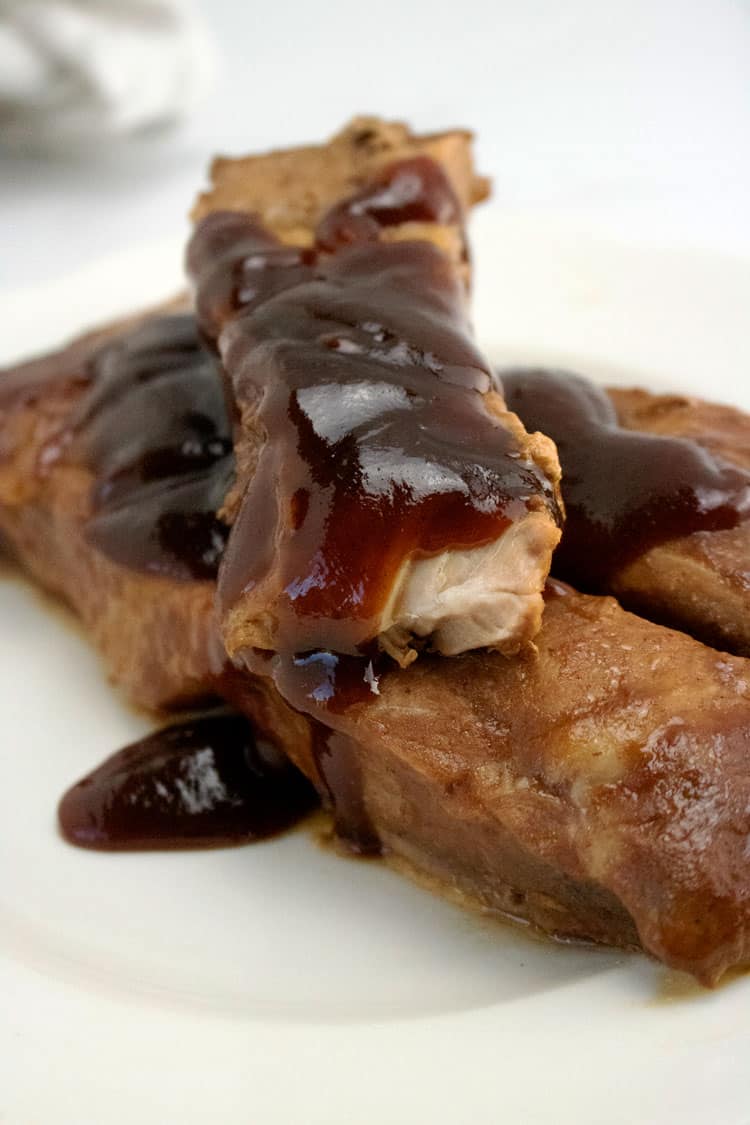 slow cooker pork ribs on a white plate