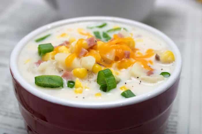 slow cooker corn chowder in red bowl