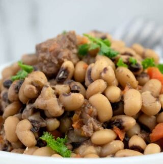 slow cooker black eyed peas in white serving dish