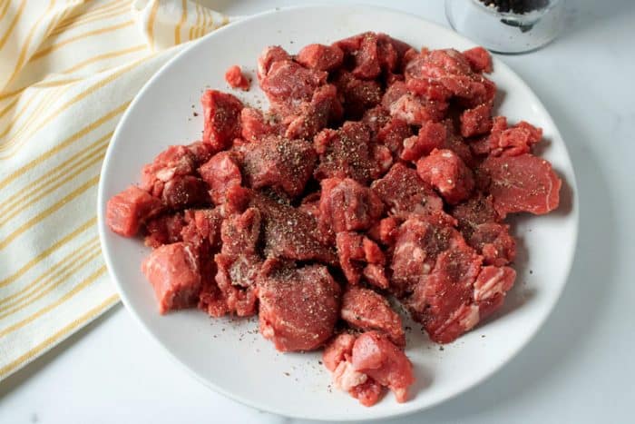 beef stew meat on white plate