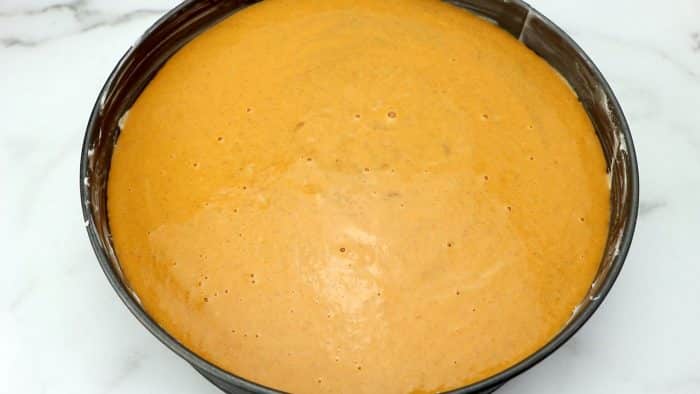 unbaked pumpkin pie in spring form pan