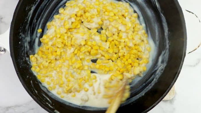 stirring the creamed corn