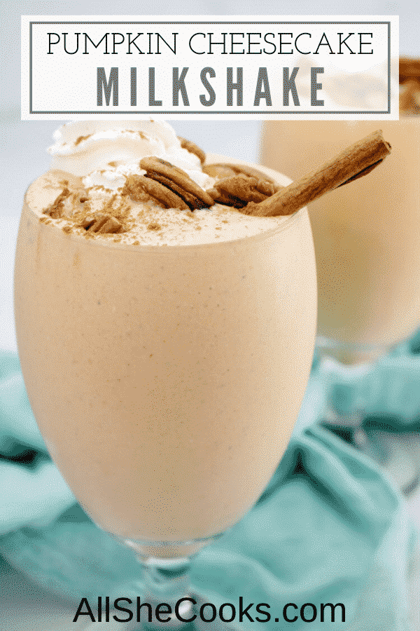 pumpkin cheesecake milkshake recipe in a glass topped with whipped cream, pecans and a cinnamon stick